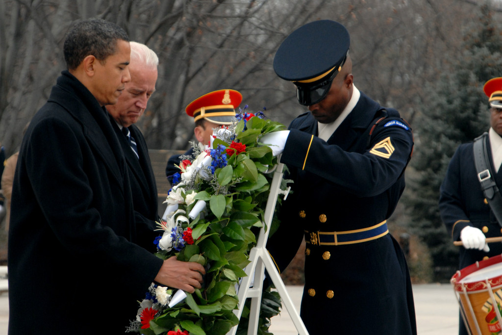 President-elect Barack Obama and Vice President-elect Joe Biden observe a moment of silence while laying a wreath with the assistance of Sgt. of the Guard, Alfred Lanier at the Tomb of the Unknowns in Arlington National Cemetery in Virginia Jan. 18, 2009. President-elect Obama is taking part in inaugural events leading up to his swearing-in ceremony on Jan. 20, 2009. (DoD photo by Sgt. Jeremy Kern, U.S. Army/Released)